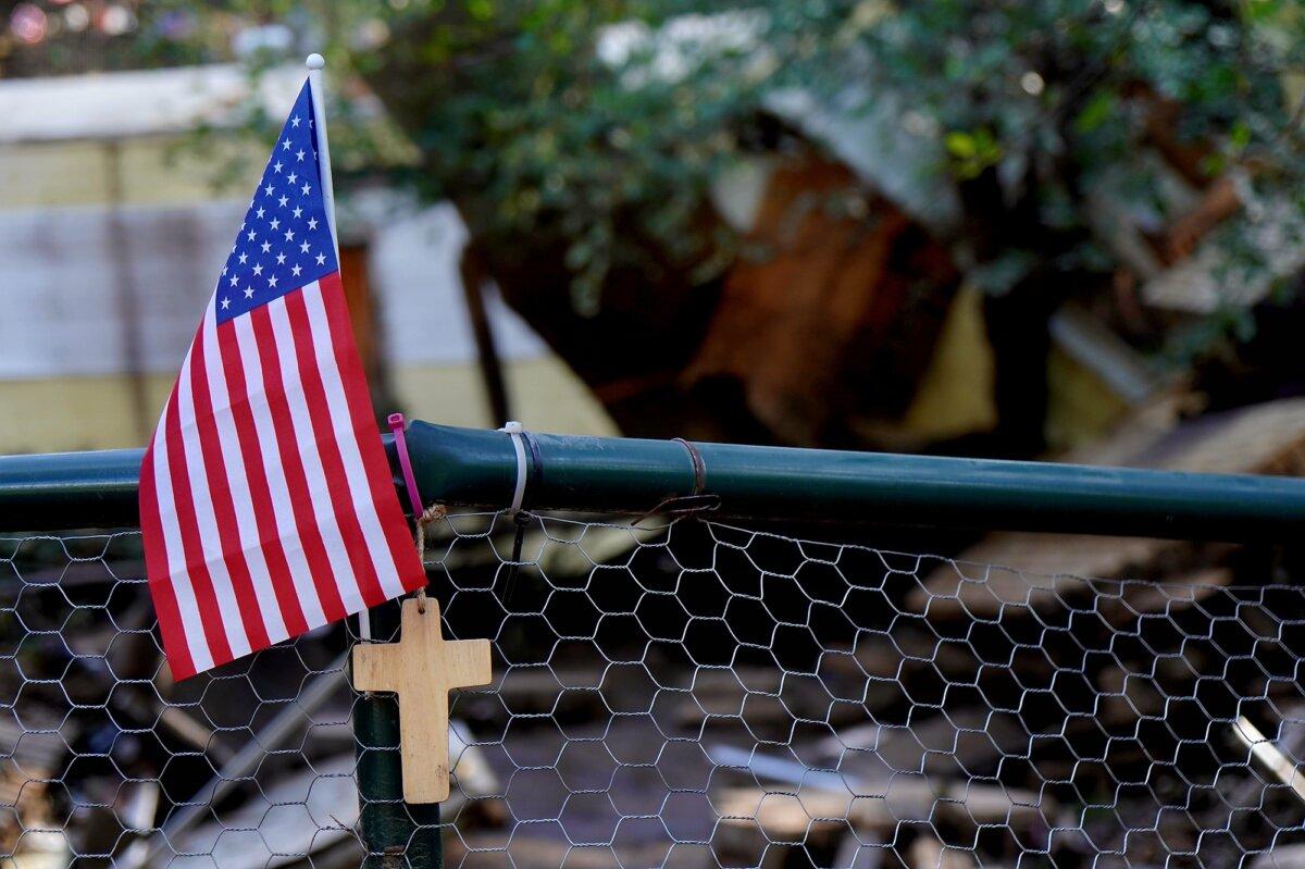 A makeshift shrine near the receding floodwaters of the Rio Ruidoso in southern New Mexico on July 9, 2025. (Allan Stein/The Epoch Times)