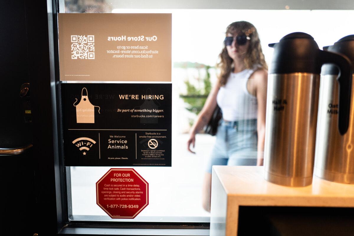 A hiring ad is displayed at a coffee shop in Kerrville, Texas, on July 9, 2025. (Madalina Kilroy/The Epoch Times)