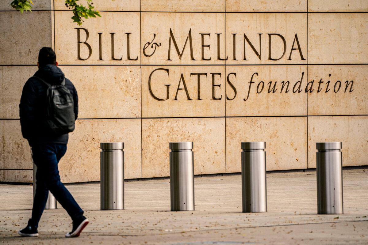 A pedestrian walks past the Bill and Melinda Gates Foundation in Seattle on May 4, 2021. (David Ryder/Getty Images)
