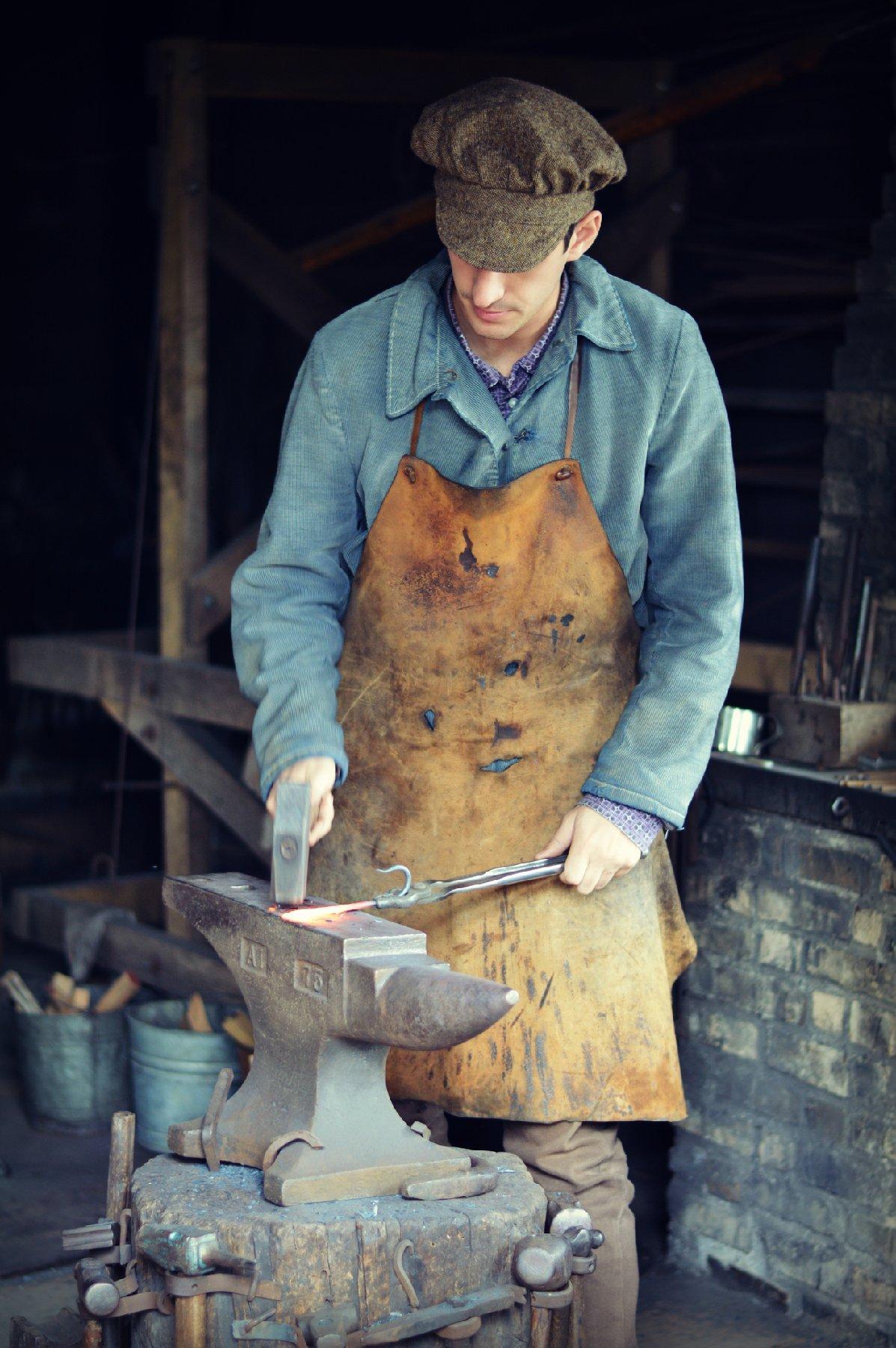 A reenactor at Old World Wisconsin near Eagle demonstrates how blacksmiths once worked. (Photo courtesy of Hannah Babiak/Dreamstime)