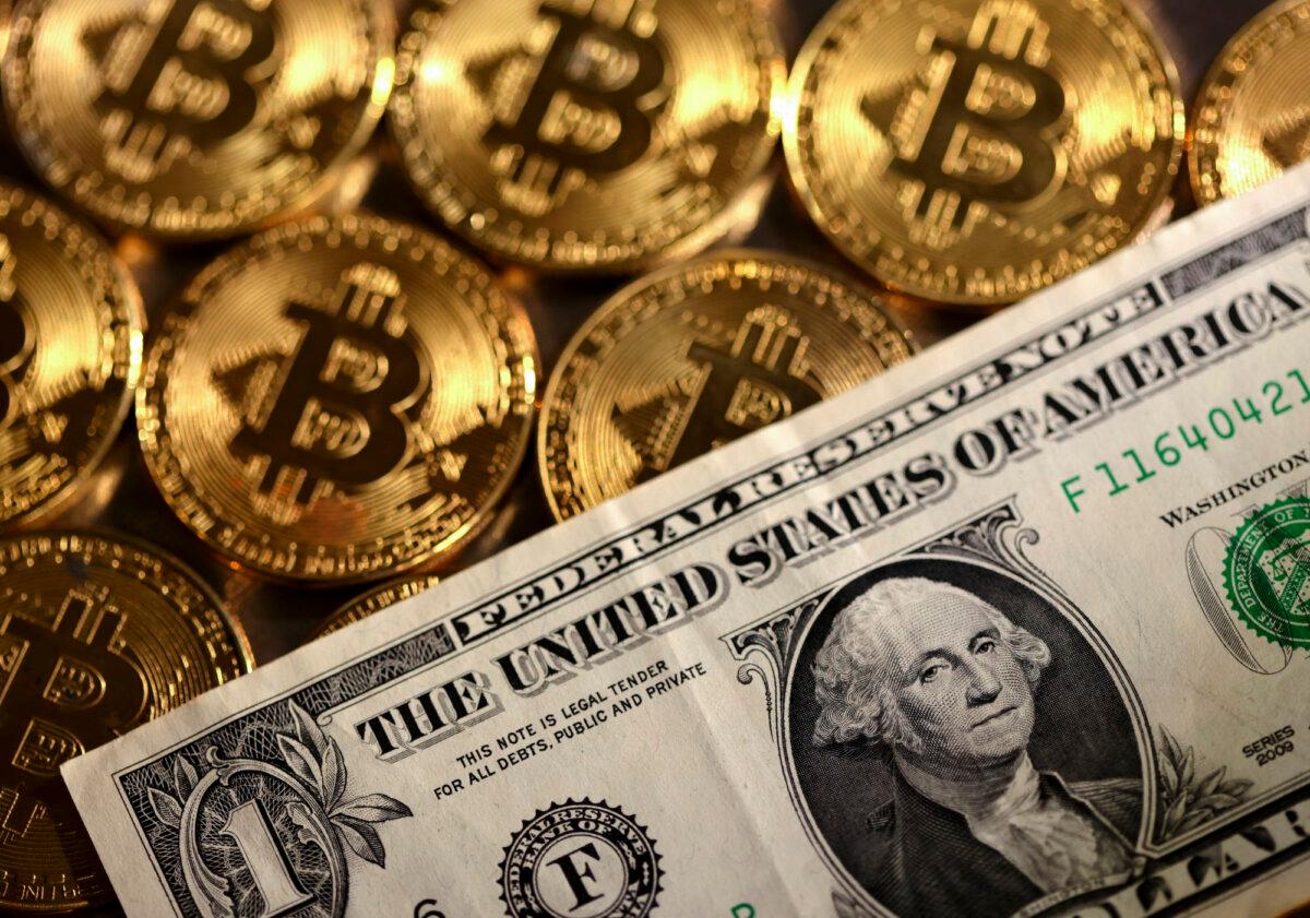 Representations of the cryptocurrency bitcoin and the U.S. dollar in this illustration from Aug. 10, 2022. (Dado Ruvic/Reuters)