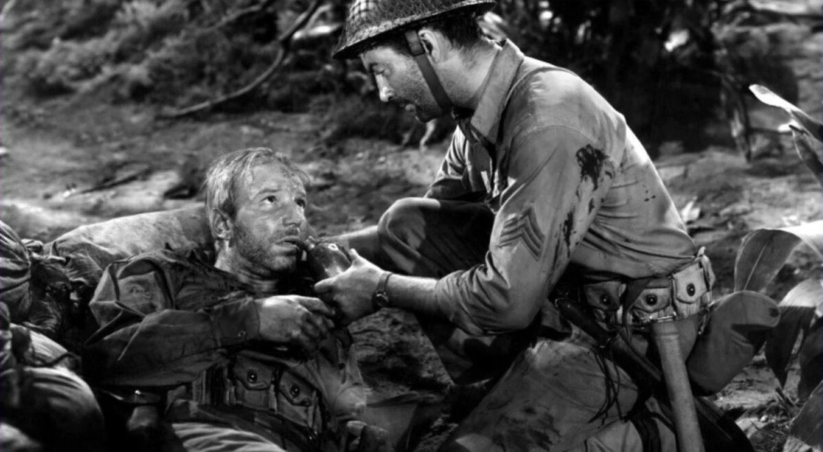 Cpl. Barney Todd (Lloyd Nolan, L) and Sgt. Bill Dane (Robert Taylor), in “Bataan.” (Metro-Goldwyn-Mayer)