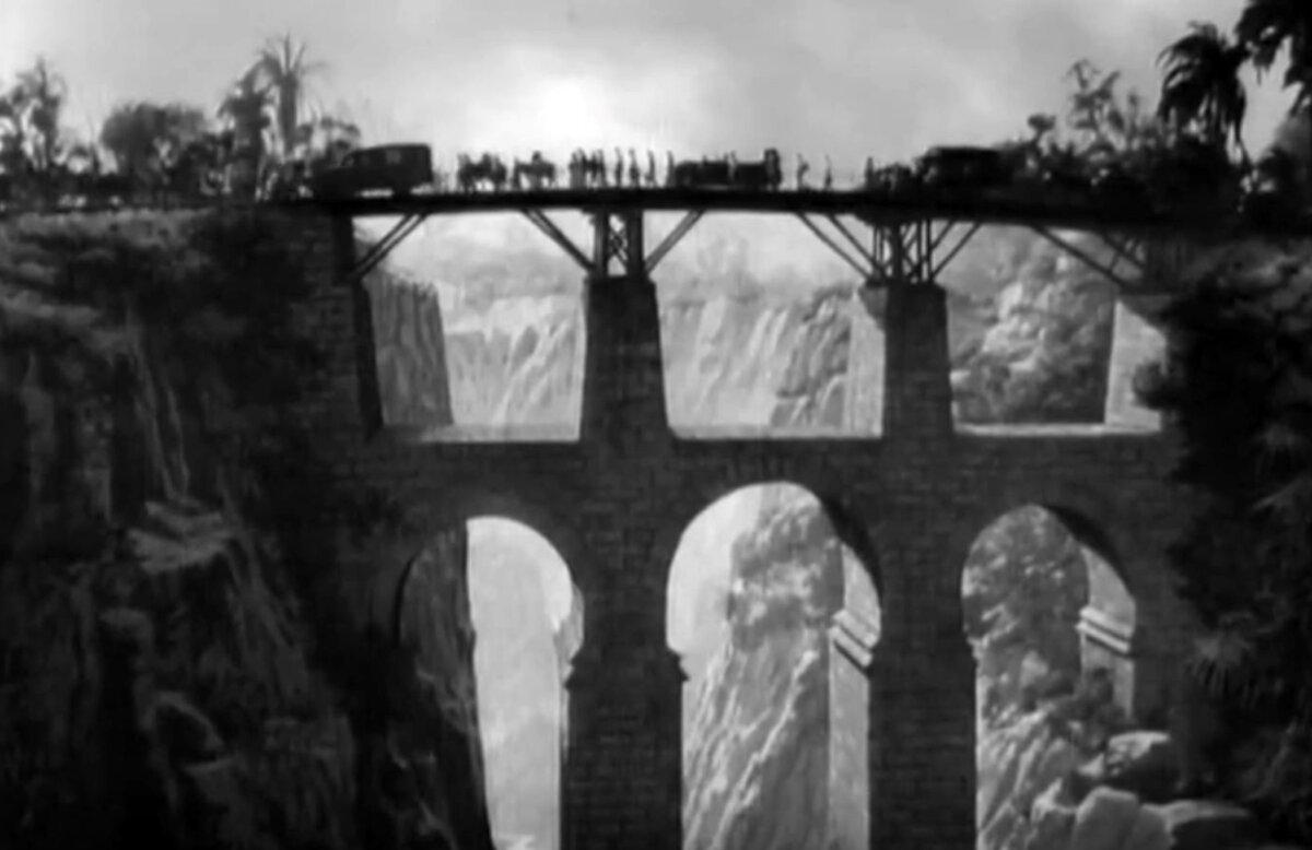 Retreating soldiers cross a bridge, in “Bataan.” (Metro-Goldwyn-Mayer)