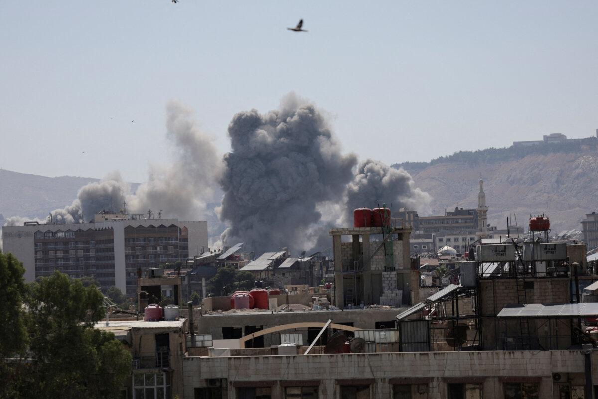 Smoke rises following an Israeli airstrike on the Syrian Defense Ministry's headquarters in Damascus, Syria, on July 16, 2025. (Khalil Ashawi/Reuters)