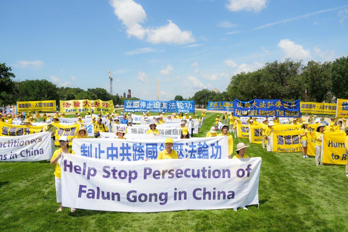Falun Gong practitioners gather for an annual rally calling for the end of the Chinese Communist Party’s ongoing persecution of Falun Gong in China, on the National Mall in Washington on July 17, 2025. (Samira Bouaou/The Epoch Times)