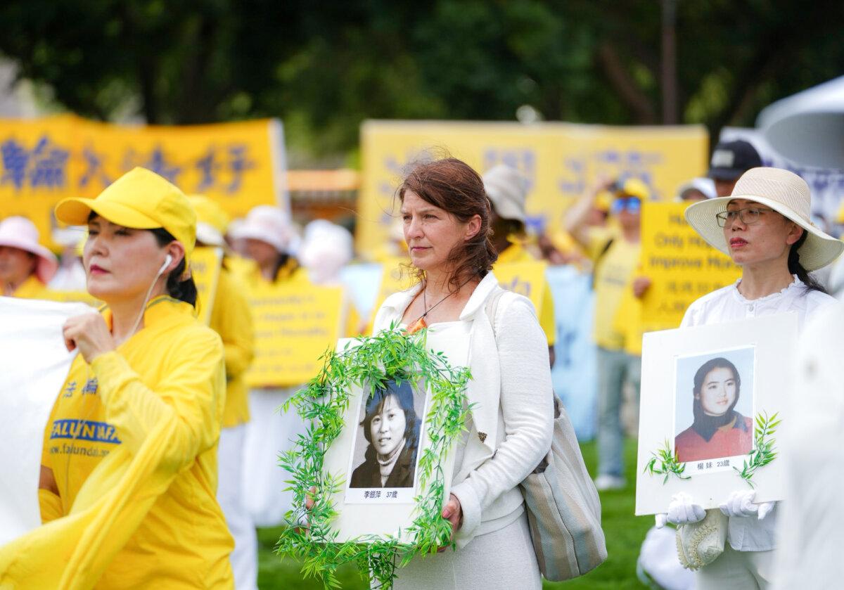 Falun Dafa practitioners gather to call for the end to the Chinese Communist Party’s ongoing persecution of Falun Gong in China, on the National Mall in Washington on July 17, 2025. (Madalina Kilroy/The Epoch Times)