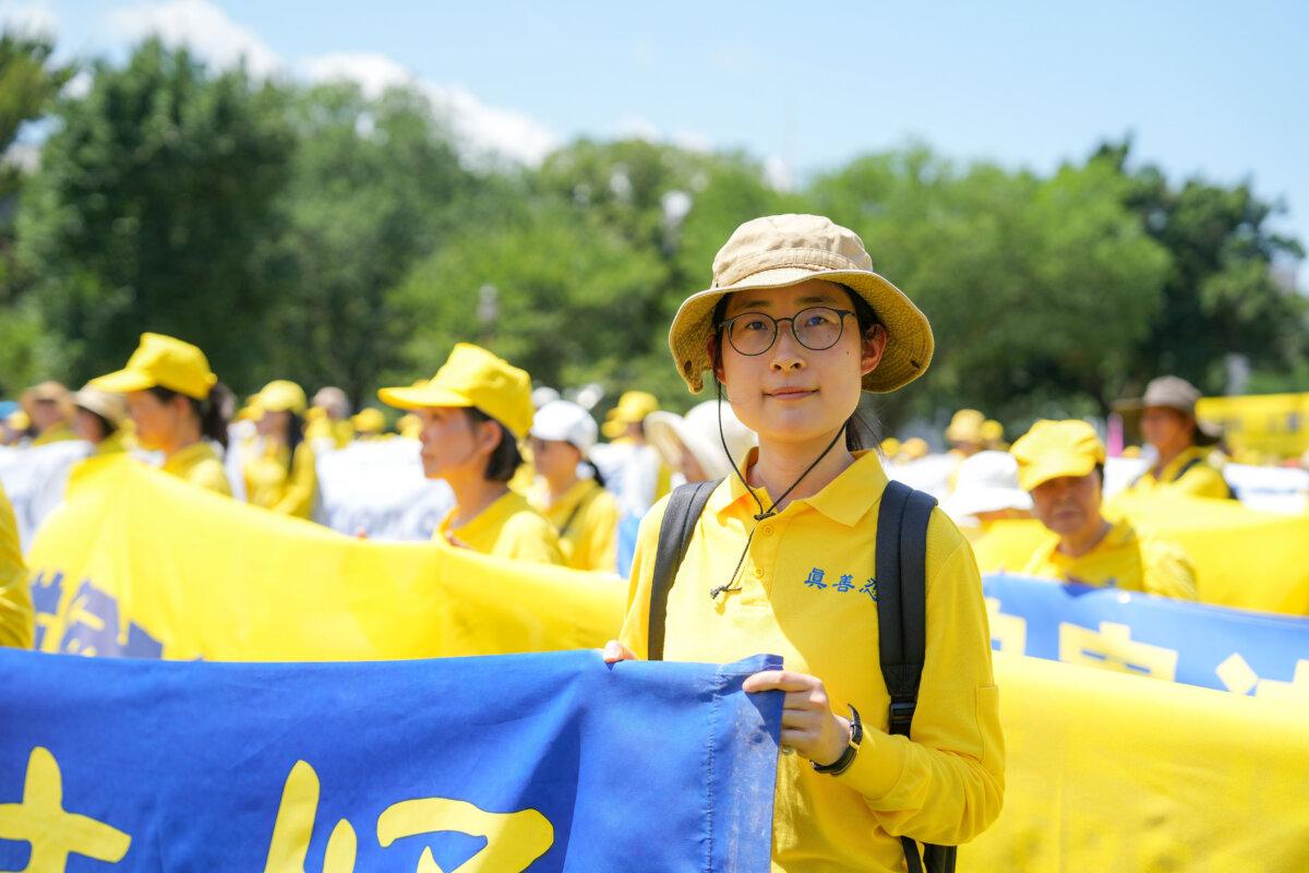Teresa Zhang attends a rally calling for the end of the Chinese Communist Party’s ongoing persecution of Falun Gong in China, on the National Mall in Washington on July 17, 2025. (Samira Bouaou/The Epoch Times)