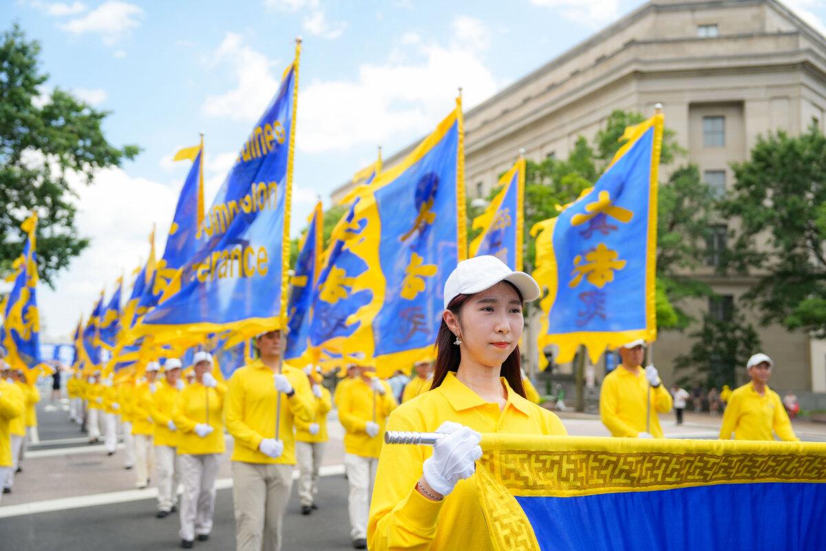 Falun Gong practitioners take part in a march calling for the end of the Chinese Communist Party’s 26 years of persecution of Falun Gong in China, in Washington on July 17, 2025. (Samira Bouaou/The Epoch Times)