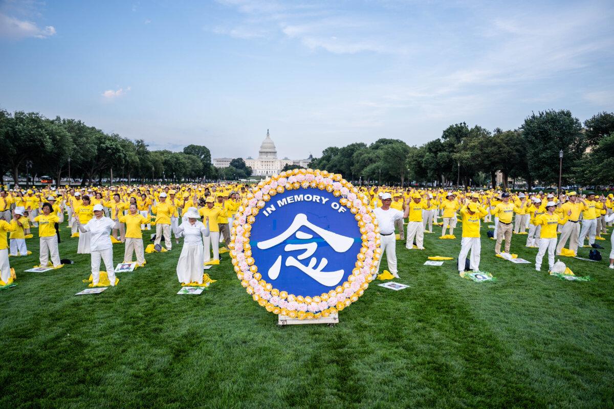 Falun Gong practitioners ahead of a candlelight vigil commemorating Falun Gong practitioners who were persecuted to death by the Chinese Communist Party in China, in Washington on July 17, 2025. (Madalina Kilroy/The Epoch Times)