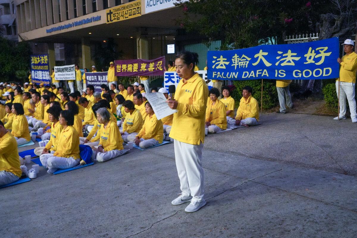 Falun Gong practitioner Wang Fengqin speaks at a candlelight memorial rally in Los Angeles on July 19, 2025. (Alex Lee/The Epoch Times)