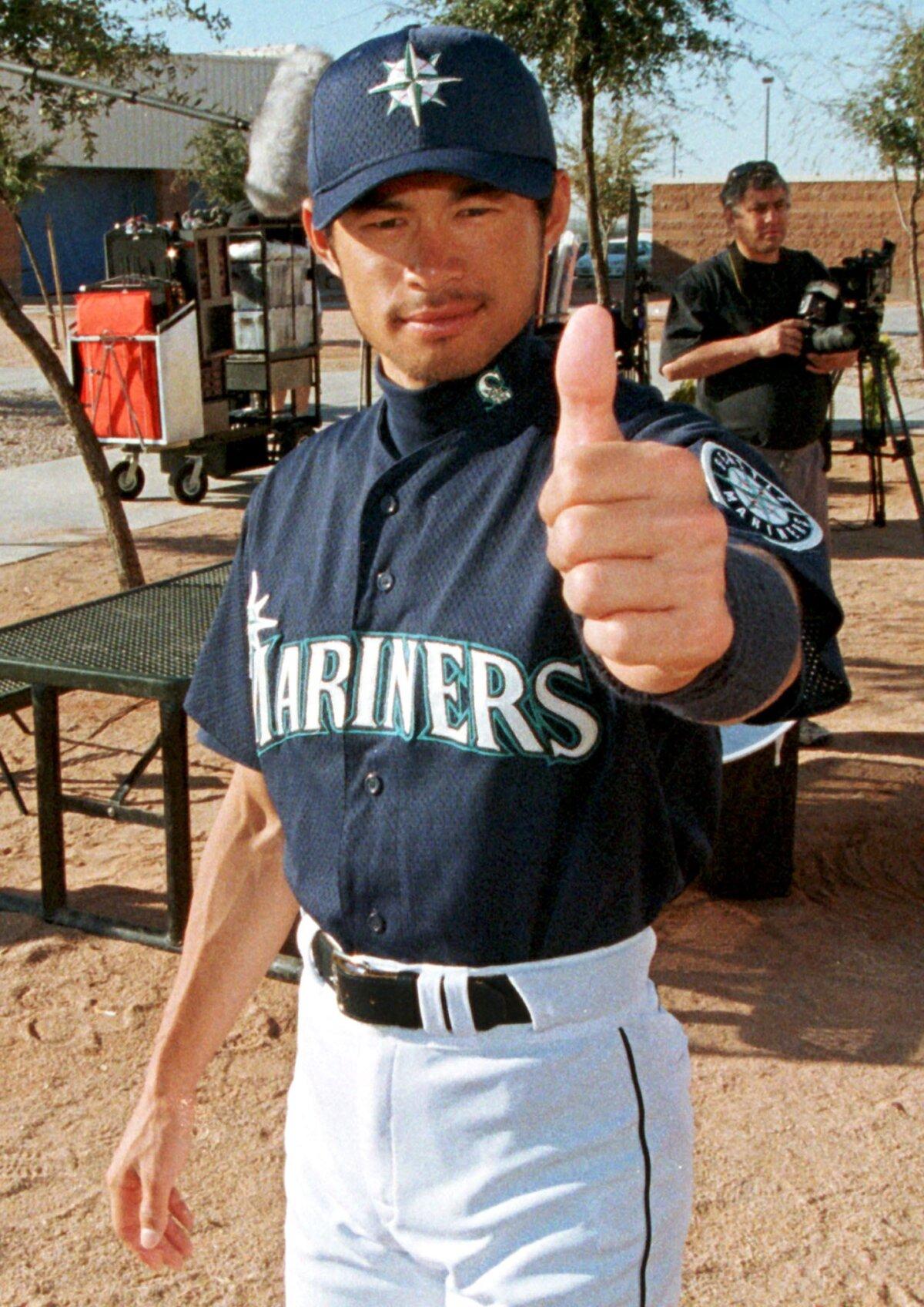 Japanese baseball player Ichiro Suzuki gives the thumbs-up prior to an interview with Major League Baseball Productions at the Seattle Mariners spring training camp in Peoria, Ariz., on Feb. 28, 1999. (Mike Fiala/AFP via Getty Images)