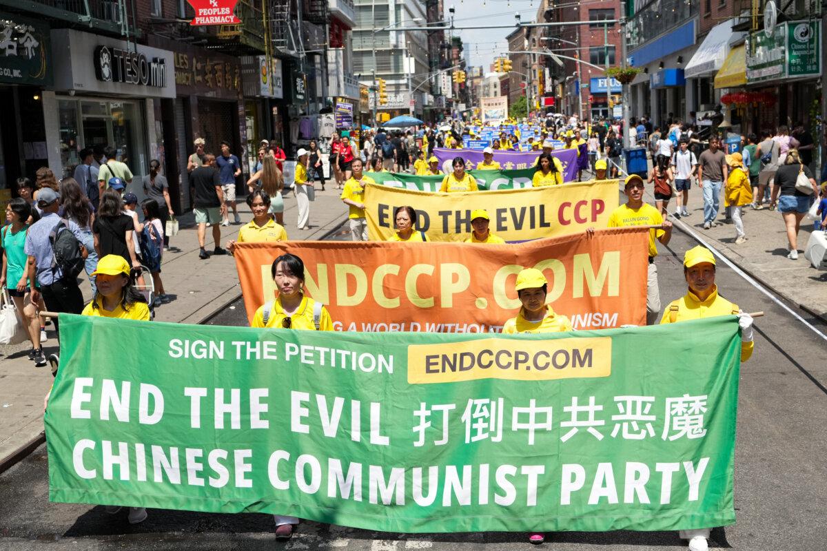 Falun Gong practitioners march during a parade calling for an end to the Chinese Communist Party’s 26-year-long persecution against the spiritual practice, in New York City on July 20, 2025. (Larry Dye/The Epoch Times)