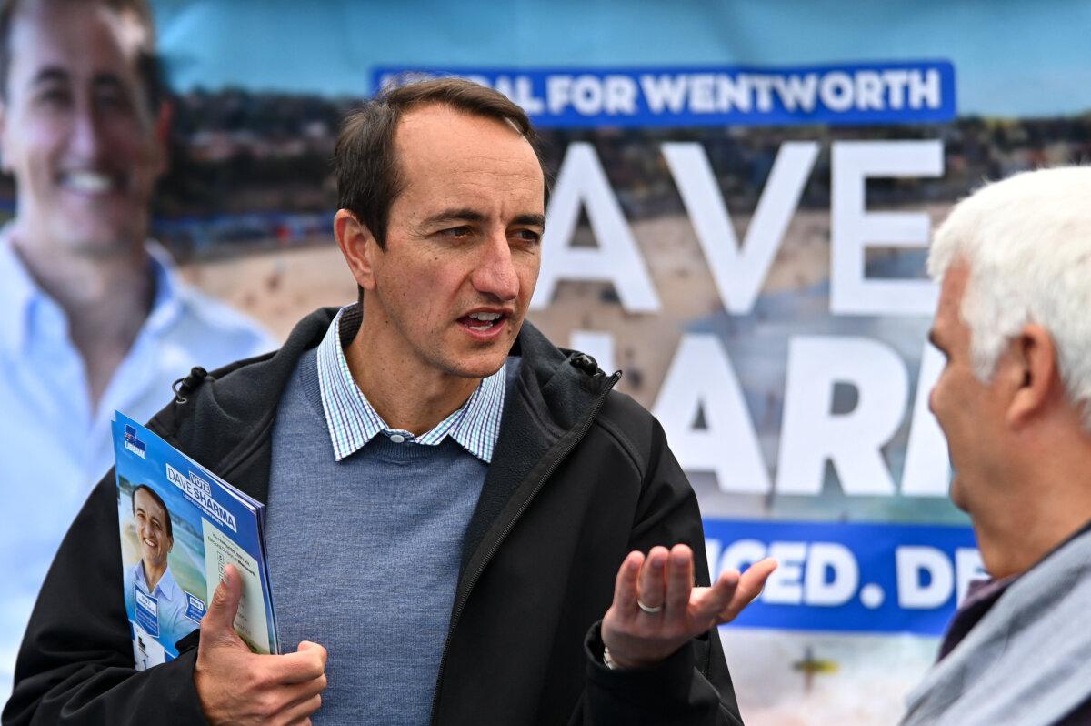 Liberal Senator Dave Sharma speaks to voters at a polling station in Sydney, Australia, on May 21, 2022. (Steven Saphore/AFP via Getty Images)