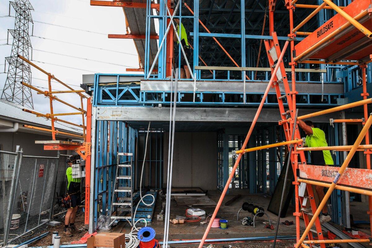 Construction workers at a building site in Lake Macquarie, Australia, on March 24, 2024. (Roni Bintang/Getty Images)