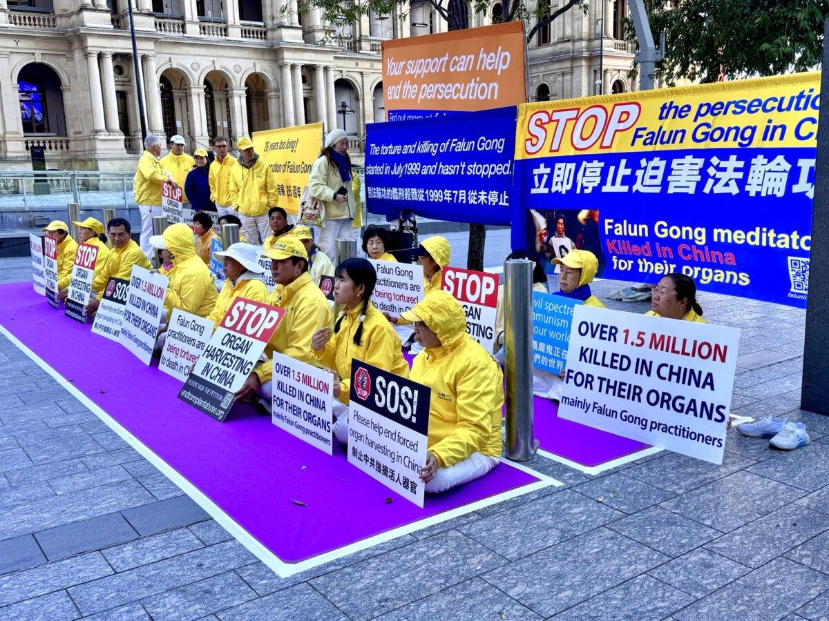Falun Gong practitioners exposing the Chinese Communist Party's (CCP) transnational repression during the 26th anniversary of the official start of the persecution against the Falun Gong meditation practice in Brisbane, Australia on July 19, 2025. (Daniel Y. Teng/The Epoch Times)