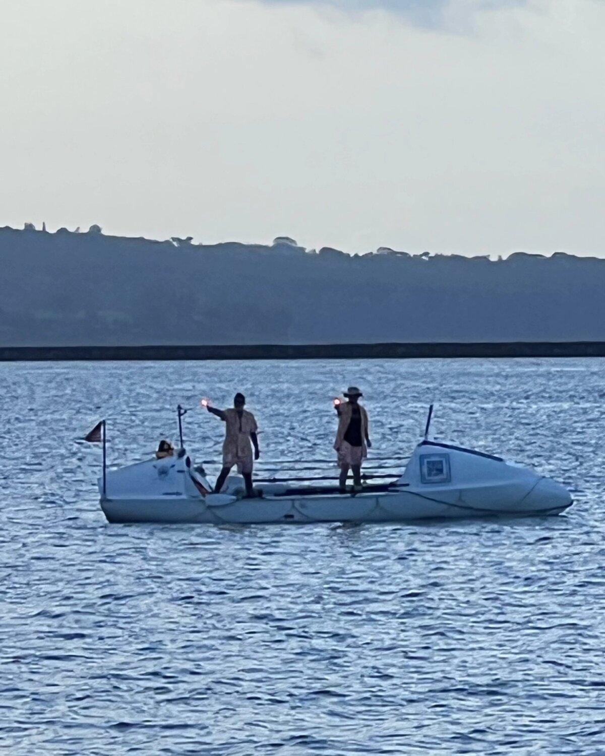 Tim Crockett and his son, Harrison, lit flares as they approached shore after rowing from San Francisco to Hawaii from June 3 to July 20, 2025. (Tame the Kraken)