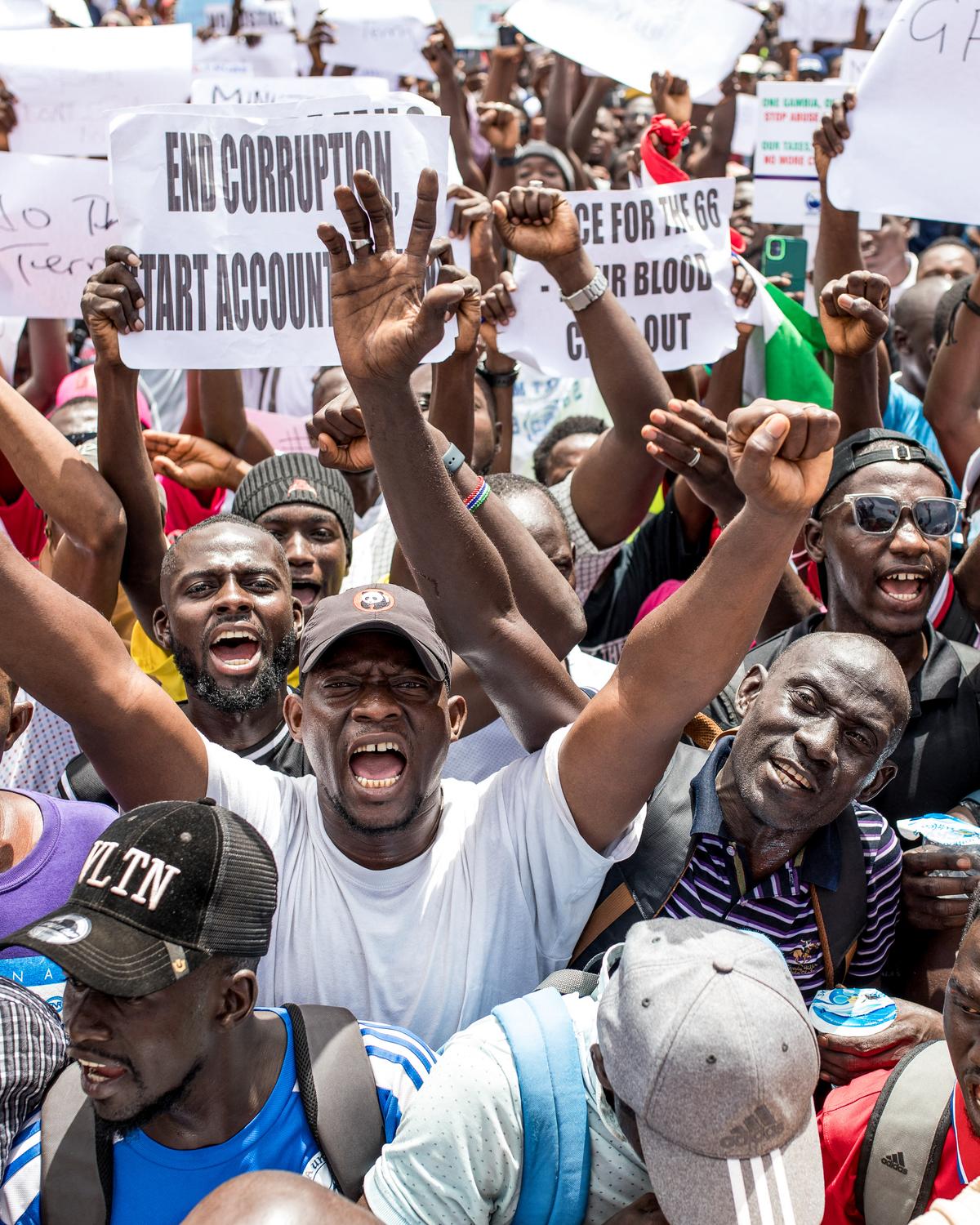 Day in Photos: Protests in Gambia, Detention of Illegal Immigrant, and Peace Talks Between Ukraine and Russia