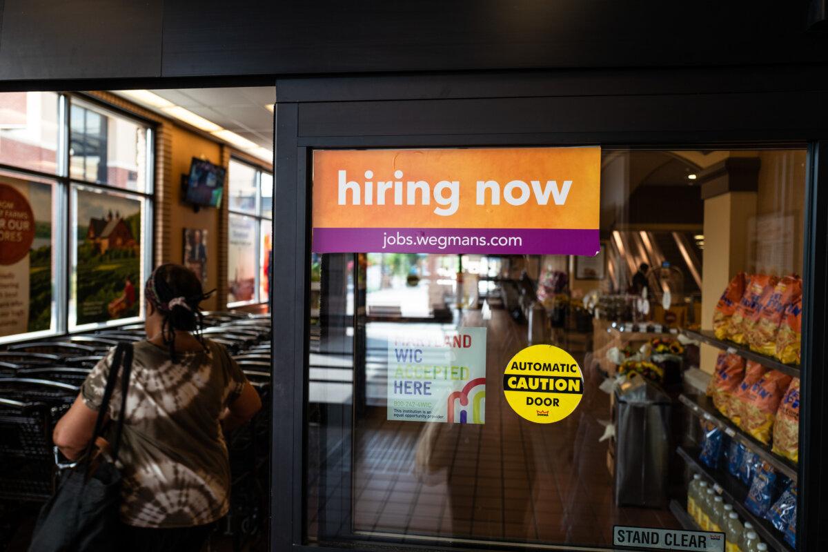 Hiring ad displayed at a store in Columbia, Md., on July 21, 2025. (Madalina Kilroy/The Epoch Times)