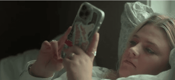 Hege Wik, typically on her phone prior to attending a folkehogskole, in "Folktales." (Magnolia Pictures)