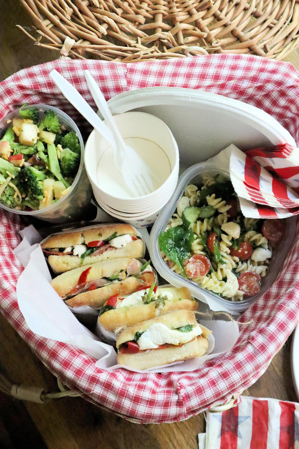 Foods that travel well on a summer roadtrip include, from left, broccoli salad with apple and dried cherries, pressed Italian sandwiches and pasta salad with fresh mozzarella. (Gretchen McKay/The Pittsburgh Post-Gazette/TNS)