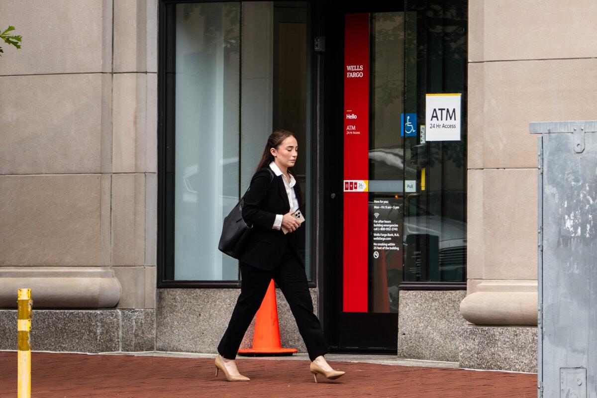A person walks past a Wells Fargo bank in Washington on July 21, 2025. (Madalina Kilroy/The Epoch Times)