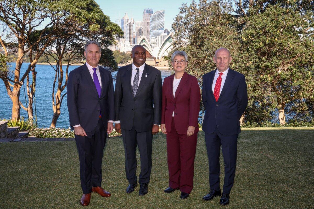 (L-R) Australia's Deputy Prime Minister and Minister for Defence Richard Marles stands in front of the Sydney Opera House with Britain's Foreign Secretary David Lammy, Australia's Foreign Minister Penny Wong and Britain's Defence Secretary John Healey, before the start of the Australia-UK Ministerial Consultations (AUKMIN) meeting in Sydney, Australia on July 25, 2025. (David Gray/AFP via Getty Images)
