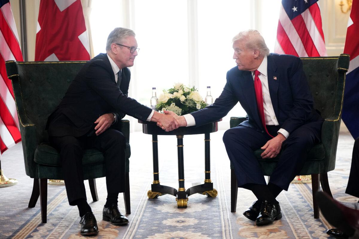 U.S. President Donald Trump shakes hands with British Prime Minister Keir Starmer (L) at Trump Turnberry golf club in Turnberry, Scotland, on July 28, 2025. (Christopher Furlong/Getty Images)