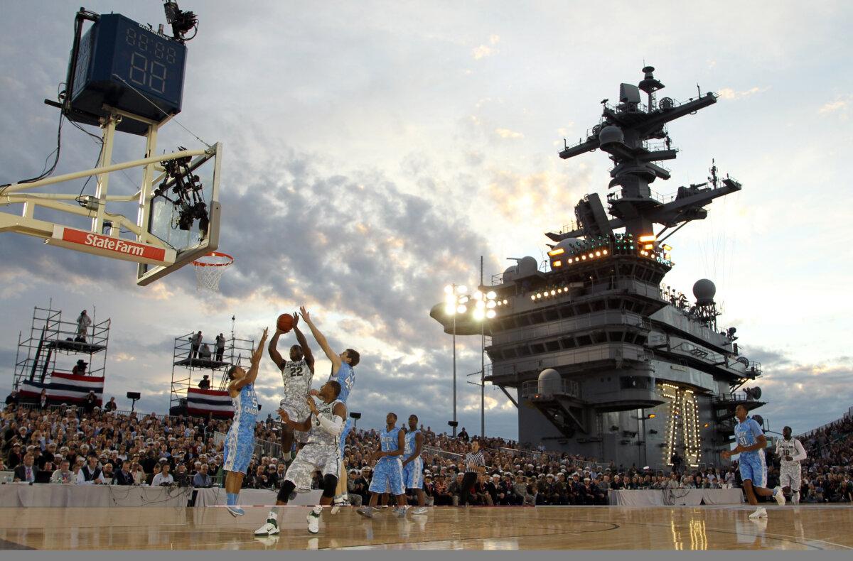 MLB Speedway Classic Set to Break Single-Game Attendance Record on Saturday 2 Branden Dawson (22) of the Michigan State Spartans goes up for a shot against the North Carolina Tar Heels during the Quicken Loans Carrier Classic on board the USS Carl Vinson in Coronado, Calif., on Nov. 11, 2011. (Ezra Shaw/Getty Images)