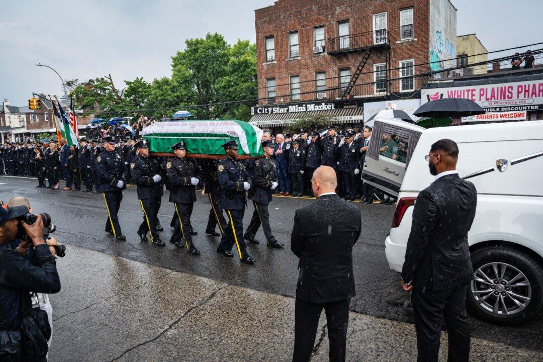 Mourners Honor NYPD Officer Killed in Attack at NFL Headquarters Building