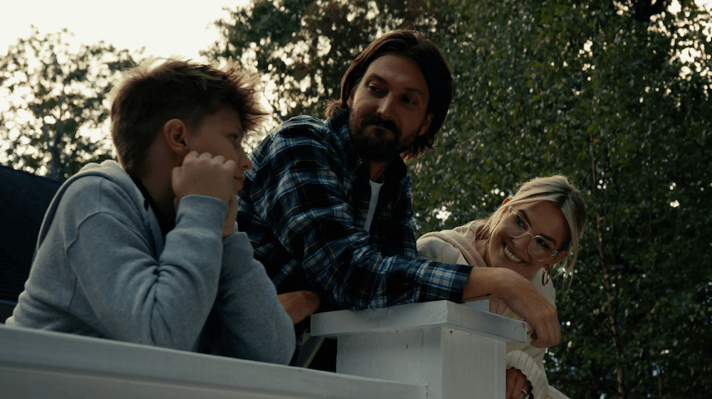 (L–R) Scott (Hudson Hensley), his dad Charlie (Josh Futcher), and his mom Charlotte (Allee Sutton Hethcoat), in "The Wild Man of Shaggy Creek." (323 Films/Family Movie Events)