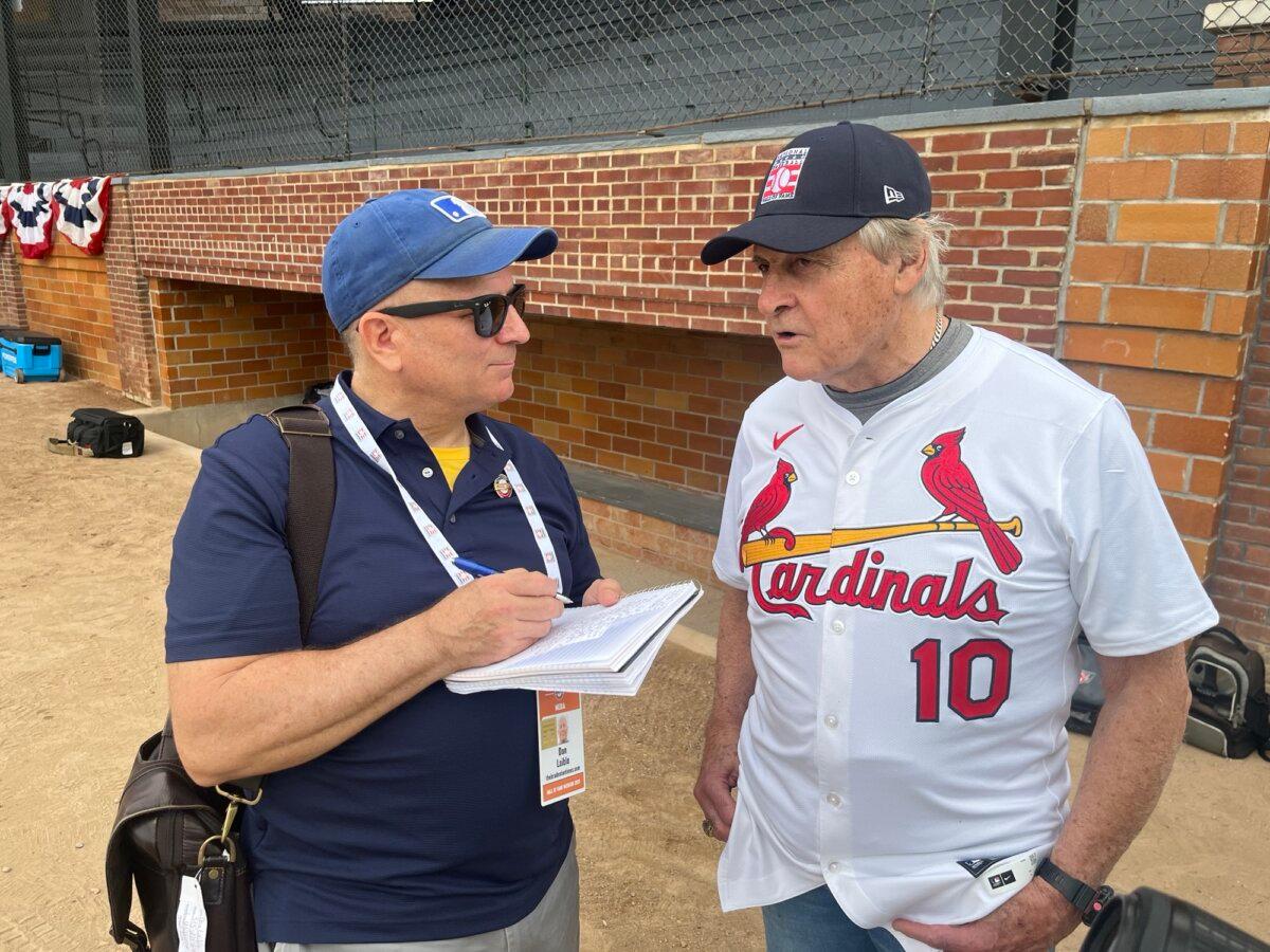 Interviewing Hall of Famer Tony La Russa (R) about his animal rescue foundation. (Courtesy of Donald Laible)