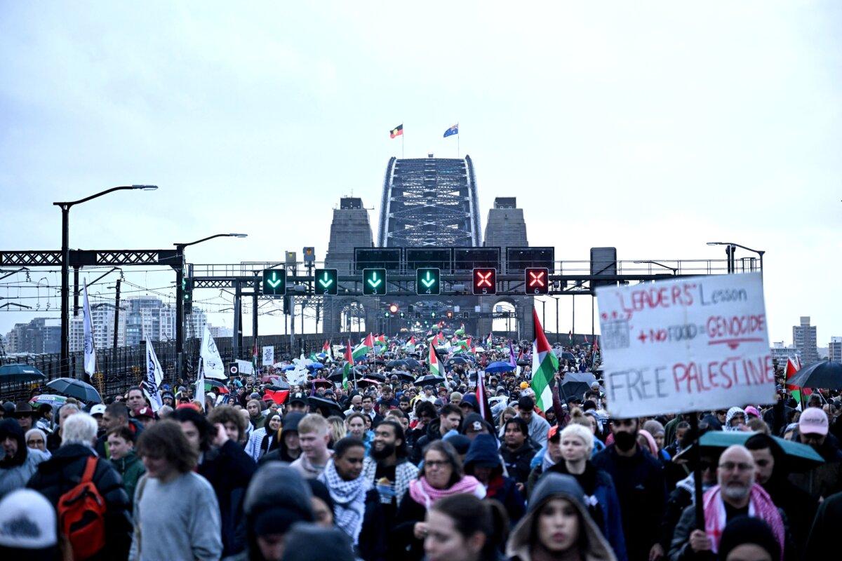 Demonstrators march across the Sydney Harbour Bridge during a pro-Palestinian rally against Israel's actions and the ongoing food shortages in the Gaza Strip, in Sydney, Australia on Aug. 3, 2025. (Saeed Khan/AFP via Getty Images)