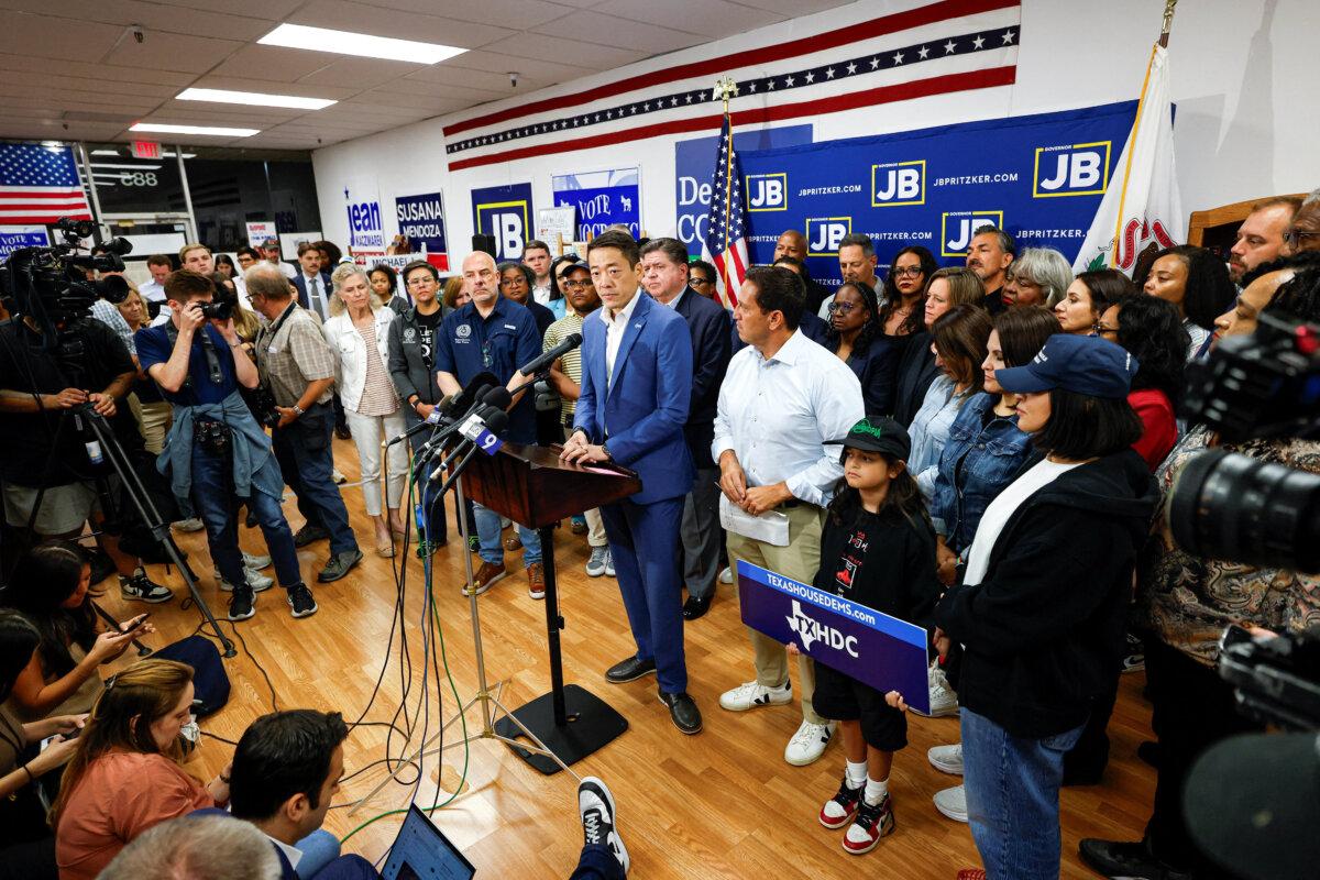 Texas state Rep. Gene Wu speaks in front of Democratic lawmakers from Texas during a press conference with Illinois Gov. J.B. Pritzker, after leaving their state to deny Republicans the quorum needed to redraw the state's 38 congressional districts, in Carol Stream, Ill., on Aug. 3, 2025. (Kamil Krzaczynski/Reuters)
