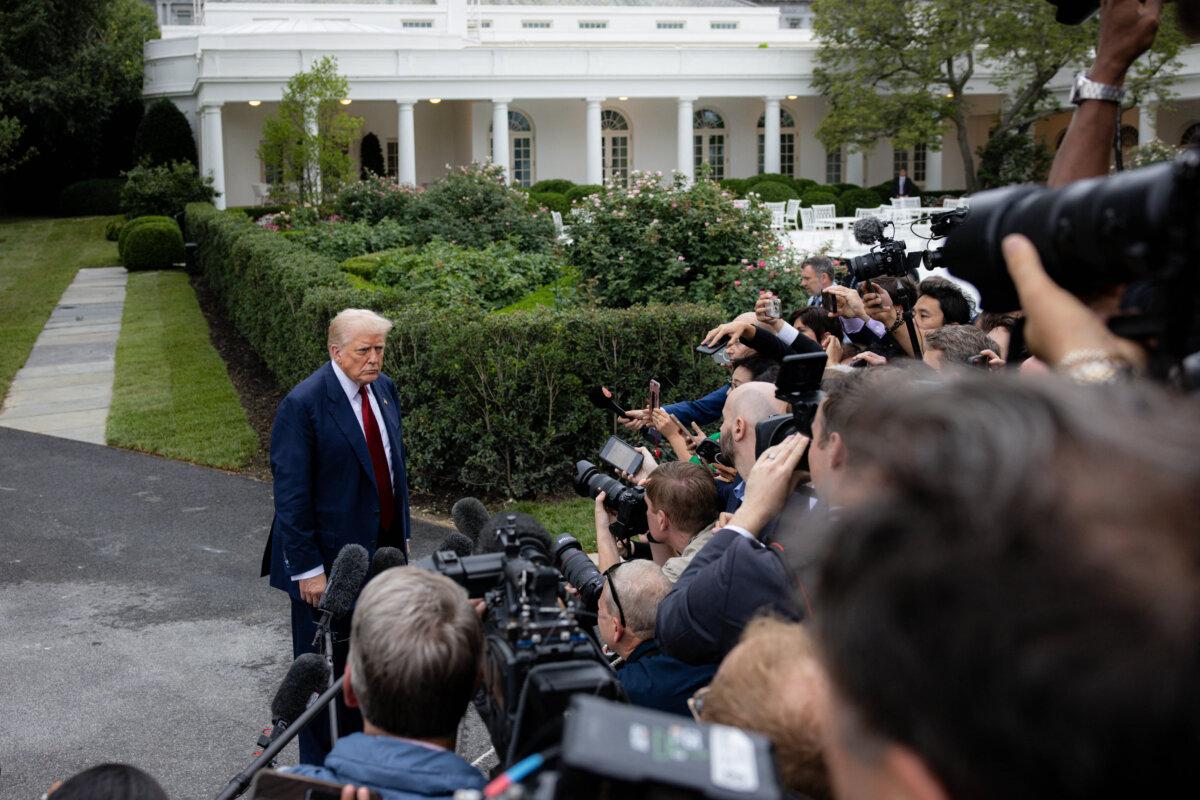 U.S. President Donald Trump speaks to the media before boarding Marine One on the South Lawn of the White House in Washington, D.C., on Aug. 1, 2025. (Mehmet Eser/Middle East Images/AFP via Getty Images)