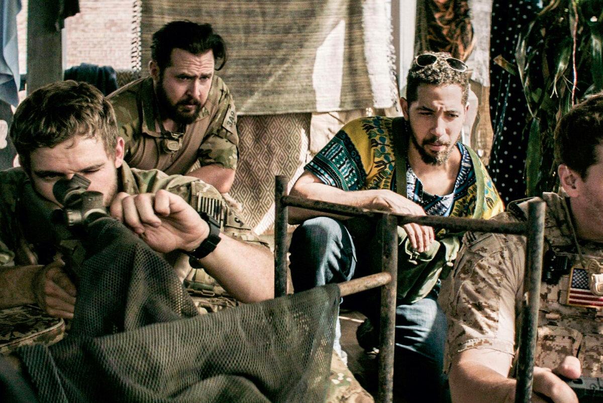 Buckley as U.S. Navy SEAL Sonny Quinn (in the back) in “SEAL Team.” (MovieStillsDB)