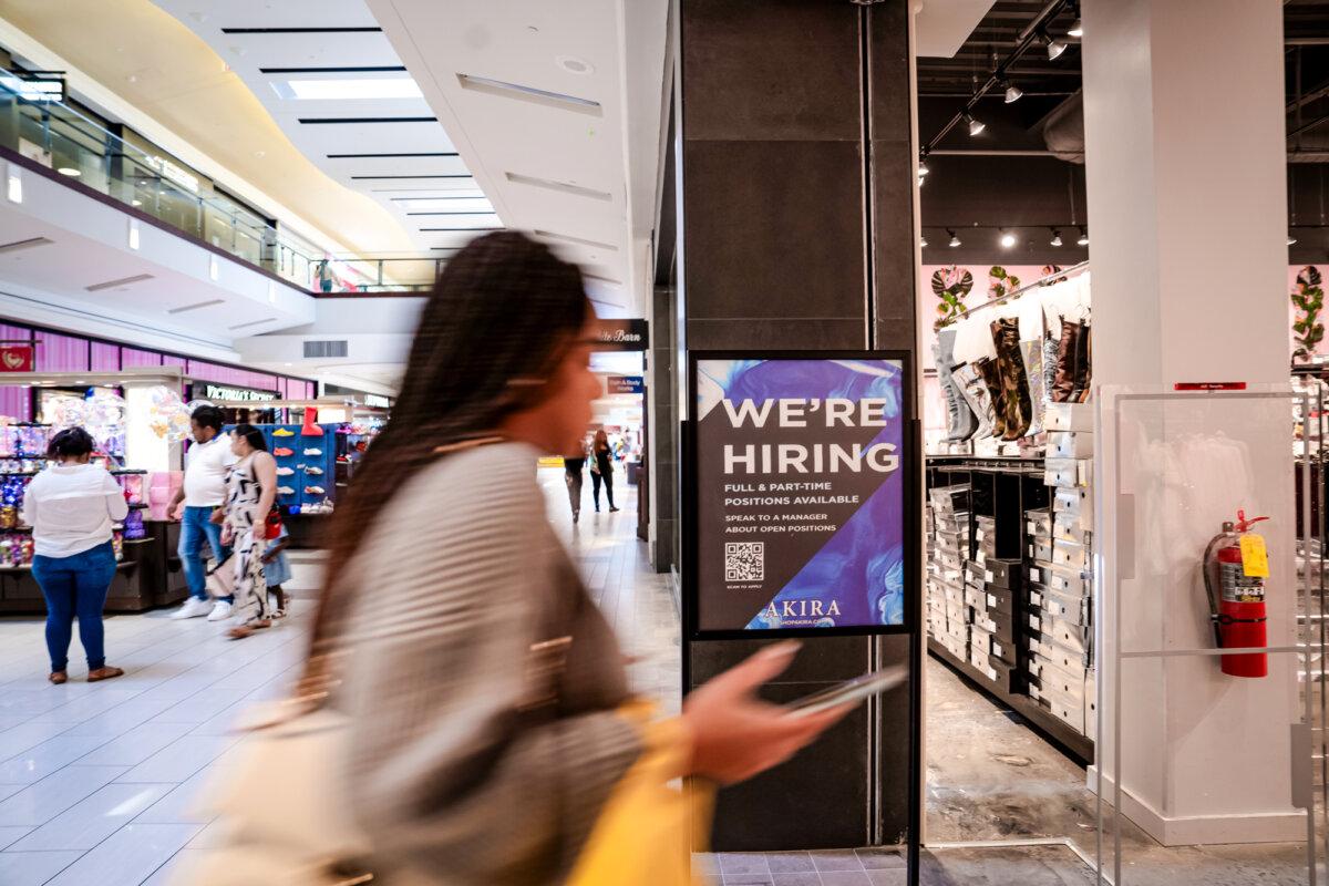 A "We're Hiring" sign at a mall in Marietta, Ga., on Feb. 22, 2024. (Madalina Vasiliu/The Epoch Times)