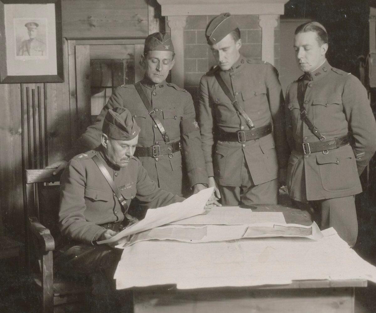 Gen. Robert Alexander studying reconnaissance data with his aides near Varennes-en-Argonne in October 1918. (Public Domain)