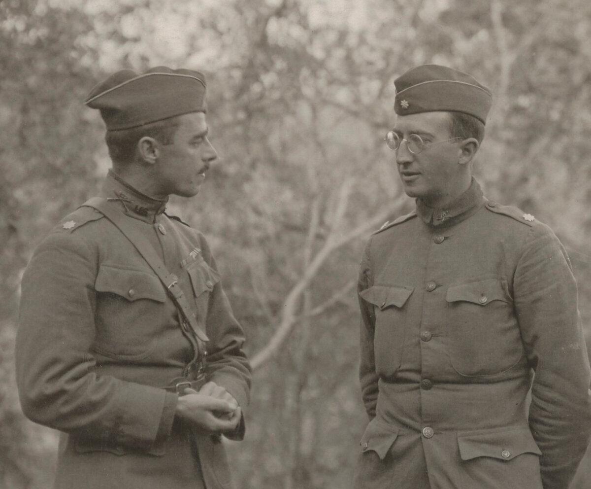 Maj. Kenny (L), 307th Infantry, talking to Maj. Whittlesey after the battle. Kenny's Third Battalion took part in the relief attempts for the "Lost Battalion." (Public Domain)