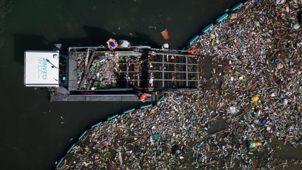 An "interceptor tender" processes plastic captured floating on the surface of the ocean in this aerial. (Courtesy of Ocean Cleanup)