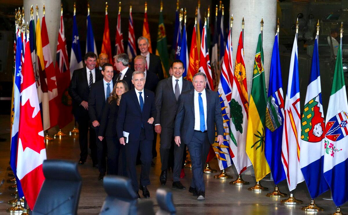 Prime Minister Mark Carney walks alongside premiers as they take part in the First Ministers Meeting at the National War Museum in Ottawa on March 21, 2025. (The Canadian Press/Sean Kilpatrick)