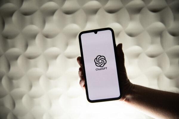 A person holds a telephone displaying OpenAI s ChatGPT artificial intelligence logo in Brittany, France ,on Feb. 26 2025. (Vincent Feuray/Hans Lucas/AFP via Getty Images)