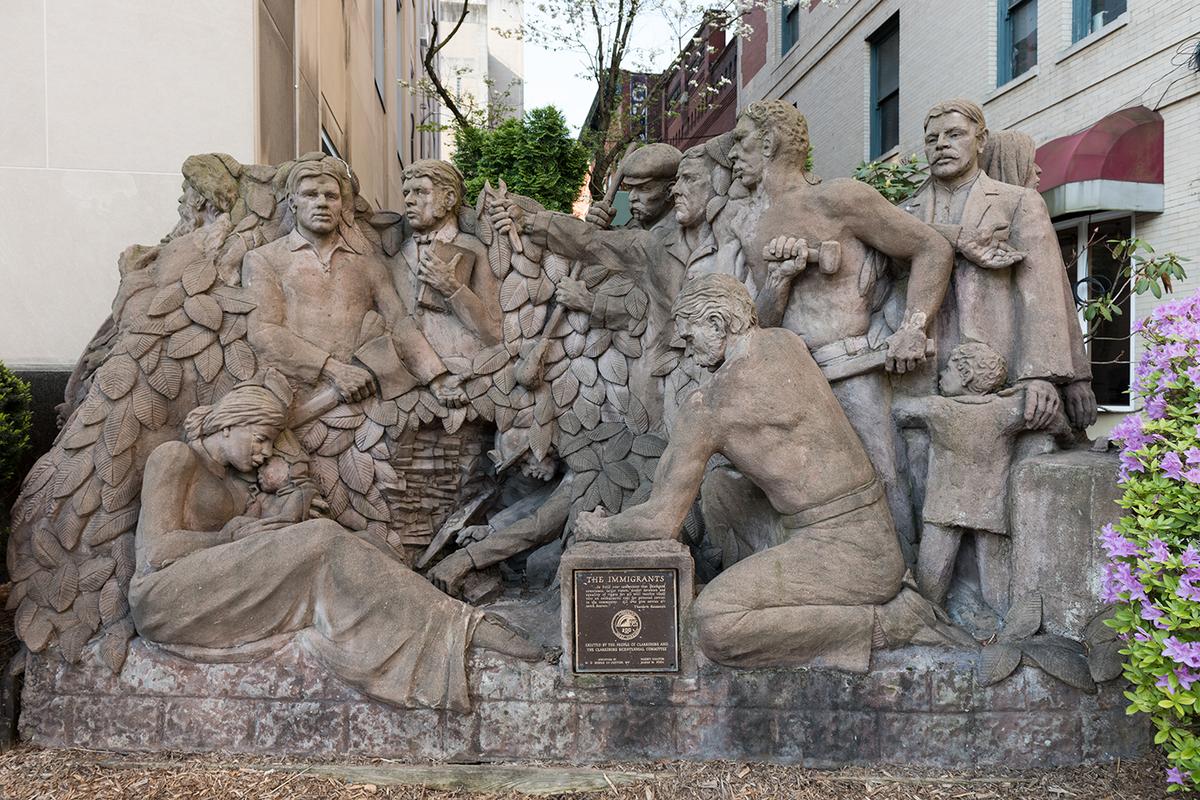 A statue celebrating American immigrants was erected outside the Harrison County Courthouse in Clarksburg, West Virginia, as part of the city's bicentennial in 1985. Library of Congress. (Public Domain)