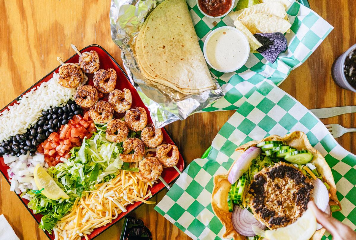 Shrimp tacos, taco salad with crabby patty, and a crab quesadilla are served at Buxton Munch in Buxton, Hatteras Island. Open since 1999, the restaurant serves fresh salads, tacos, signature crabby patties, and more. (Courtesy of VisitNC.com)