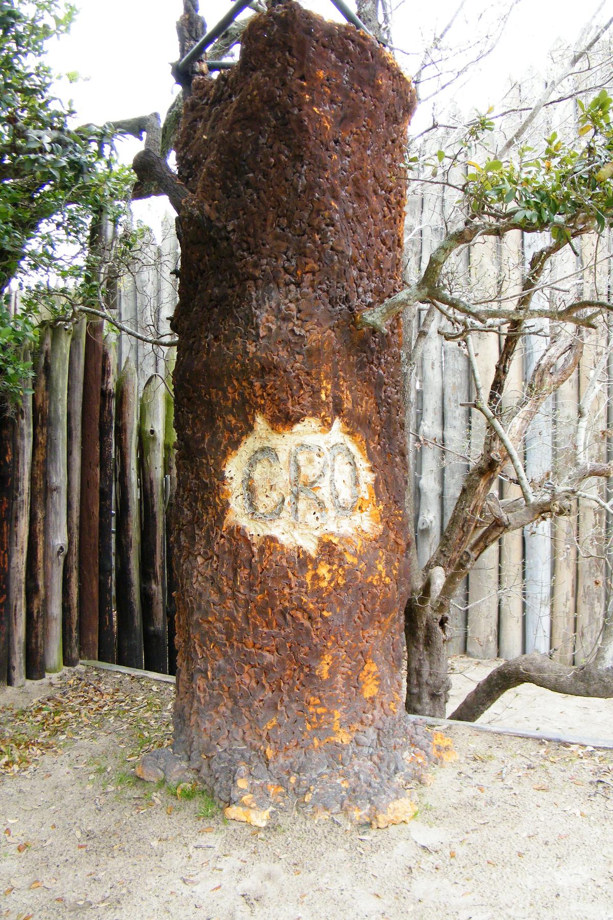 A prop from the show “The Lost Colony,” of a tree with the letters “CRO” carved on it. (Sarah Stierch/CC BY 4.0)