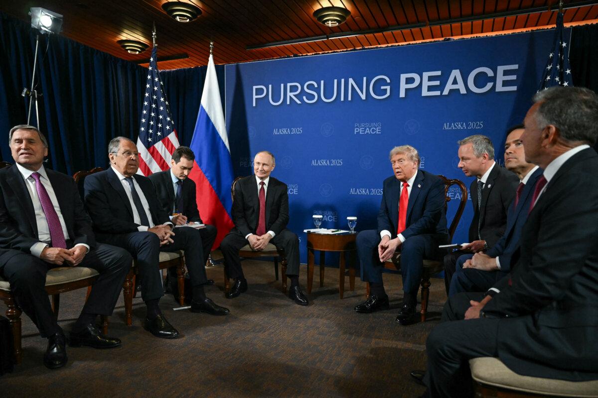 President Donald Trump (C-R) and Russian President Vladimir Putin (C-L) meet, flanked by Kremlin aide Yuri Ushakov (L), Russian Foreign Minister Sergei Lavrov (2L), US Special Envoy Steve Witkoff (R), and US Secretary of State Marco Rubio (2R), during a US-Russia summit on Ukraine at Joint Base Elmendorf-Richardson in Anchorage, Alaska, on Aug. 15, 2025. (Andrew Caballero-Reynolds/AFP via Getty Images)