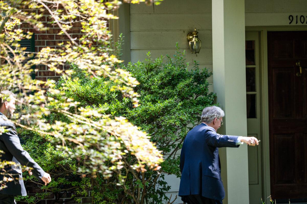 Former national security adviser John Bolton arrives at his residence after FBI raids his home in Bethesda, Md., on Aug. 22, 2025. (Madalina Kilroy/The Epoch Times)