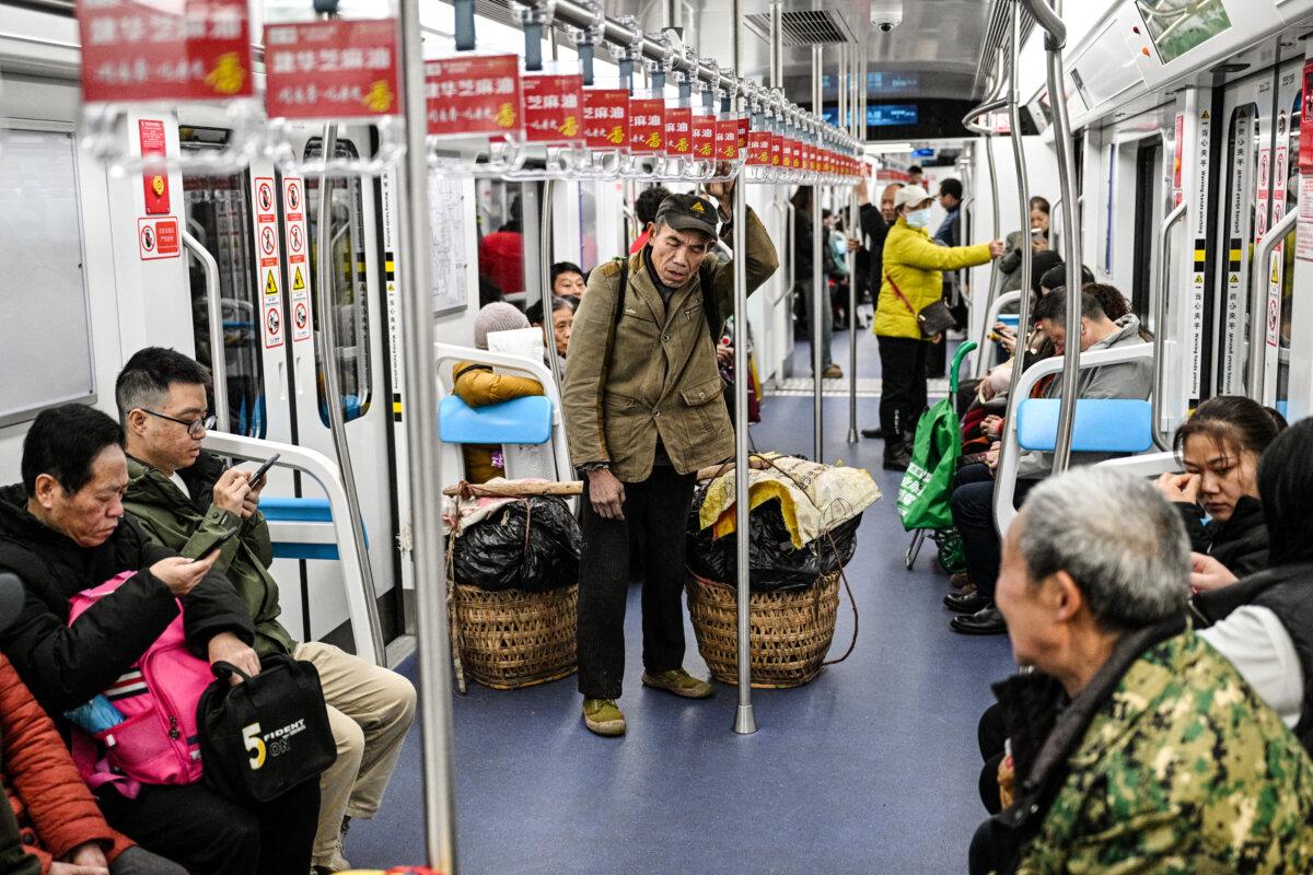 A farmer (C) travels on the subway train to sell vegetables in Chongqing, China, on March 5, 2025. As China’s economy worsens, some pensioners choose to rush into the city center to sell local produce for meager earnings. (Hector Retamal/AFP via Getty Images)
