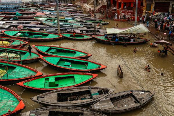 Day in Photos: Floods in India, Anniversary of Mass Knife Attack, and Corgi Race