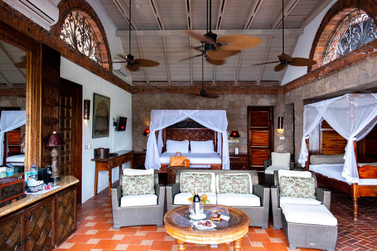 Hand-carved wooden doors unveil massive rooms with Balinese-meets-safari décor at Caille Blanc Villa & Hotel. (Benjamin Myers/TNS)