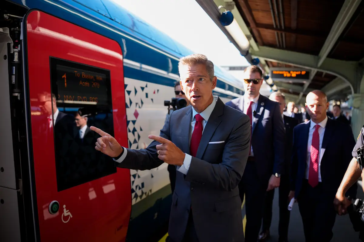 U.S. Transportation Secretary Sean Duffy (C) boards a NextGen Amtrak Acela train for a trip to Boston following a news conference for the upgraded train's first day of service in Washington on August 27, 2025. (Andrew Harnik/Getty Images)